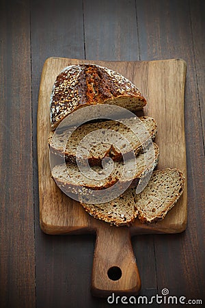 Spelt flour bread, sliced on a cutting board for breakfast