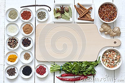 Spices and dried vegetables with cutting board