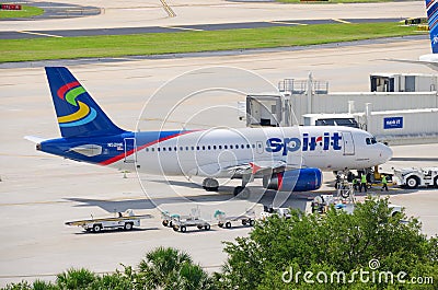 Spirit Airlines plane at airport boarding bridge