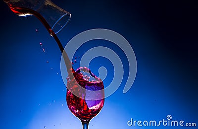 Splash glass red wine