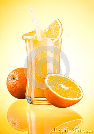 Splashing Fresh Orange Juice on yellow