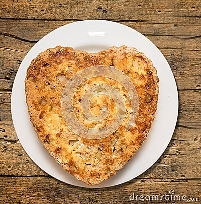 Sponge cake,heart shaped with apples and sesame