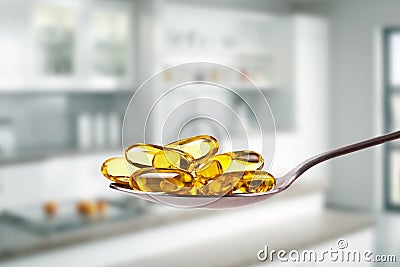 Spoon full of fish oil capsules