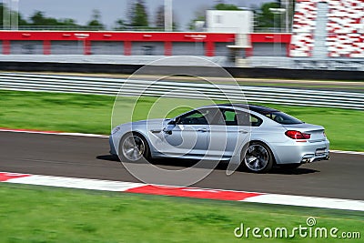 Sport car fast moving on track