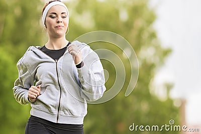 Sport Concept: Young Running Fitness Woman Training Outdoor in t