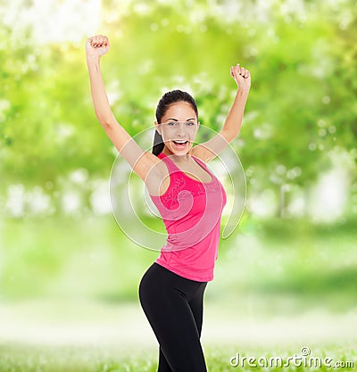 Sport fitness woman excited smile raised arm up