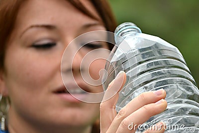 Sport young woman drinking water