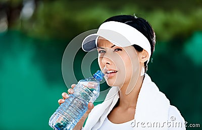 Sportive woman with bottle of water