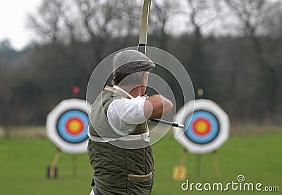 Sports Archer Aiming at Target