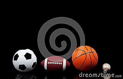 Sports balls on a black background