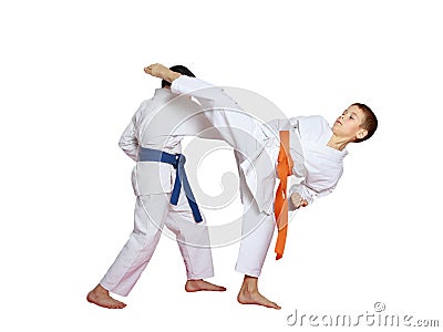 Sports paired exercises performed by athletes with blue and orange belt