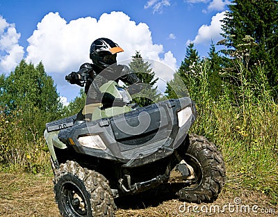 Sportsman riding quad bike