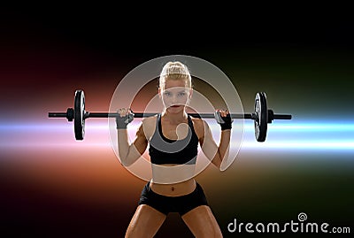 Sporty woman exercising with barbell