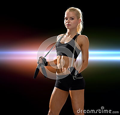 Sporty woman with skipping rope