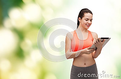 Sporty woman with tablet pc computer