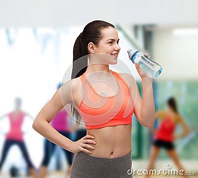 Sporty woman with water bottle