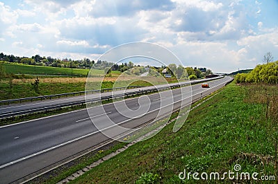 Spring country landscape with a highway