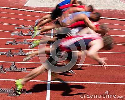 Sprinters start in blurred motion