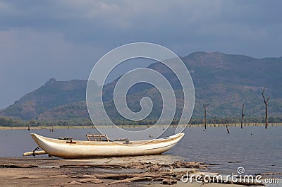 Sri lankan boat on lake beach