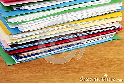 Stack of Files On Wood Surface Horizontal