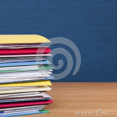 Stack of Files on Wood Surface Square