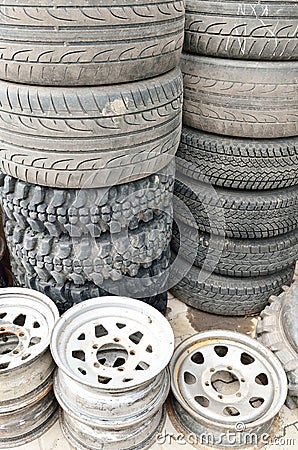 Stack of old tires and steel rims