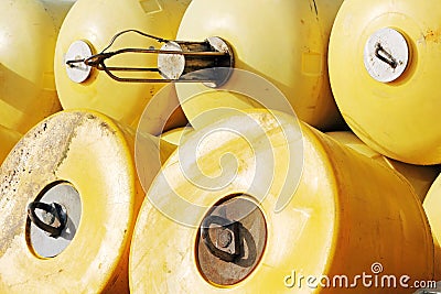 Stack of yellow buoys in a port