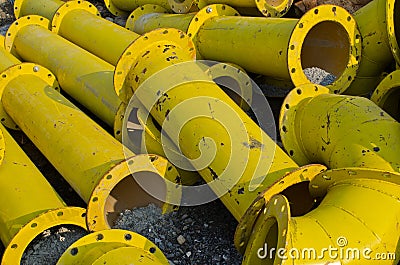 Stack of yellow steel pipe