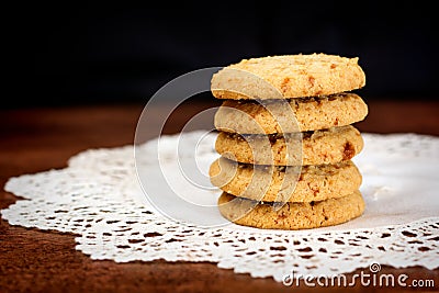 Stacked apple chip cookies on white napkin