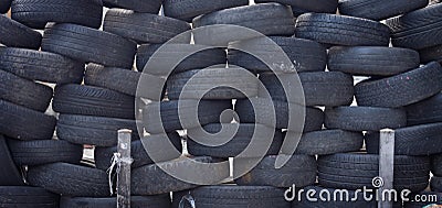 Stacked tires forming a safety barrier