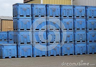 Stacks of blue shipping containers