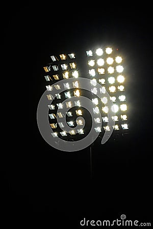 Stadium lights and dark blue sky