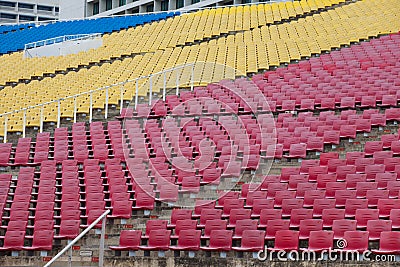 Stadium seats in red, yellow and blue color