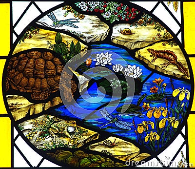 Stained glass window with animals and plants.