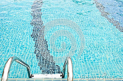 Stairway to swimming pool on aqua blue background