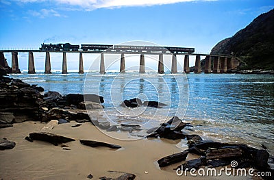 Steam train crossing Kaaimans River bridge South Africa