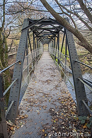 Steel span footbridge crossing a river