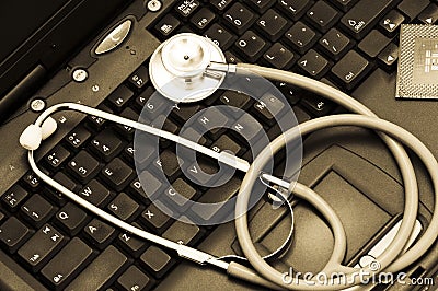 Stethoscope on a computer keyboard