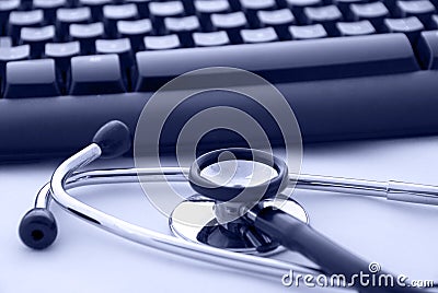 Stethoscope by a computer keyboard