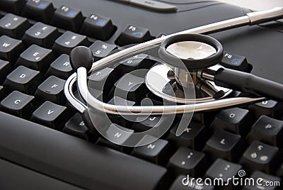 Stethoscope by a computer keyboard