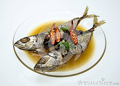 Stewed mackerel fish in salty soup