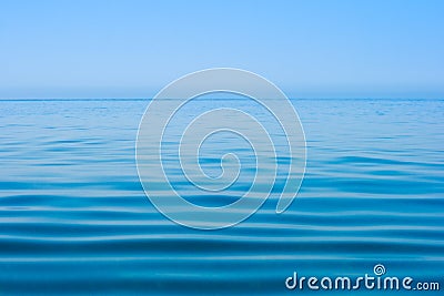 Still calm sea or ocean water surface and horizon