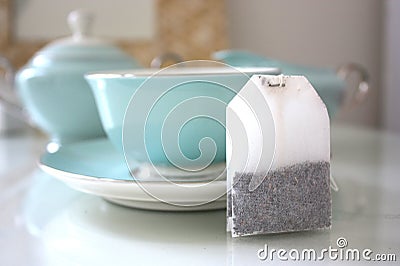 Still life of tea bag with tea service