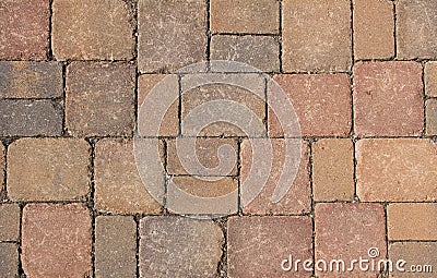 Stone pavement, background of red granite blocks