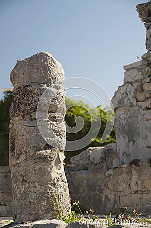 Stone pillar at ruins of Tulum Mayan temple