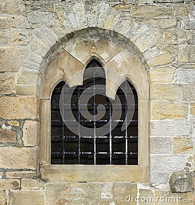 Stone window with bars