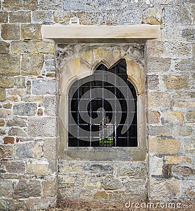 Stone window with bars