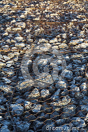 Stones protected by chain link