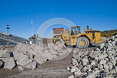 Stones and wheel loader on brekke quarries.