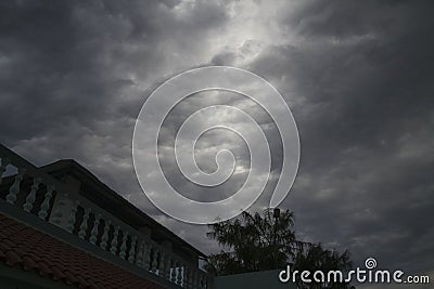 Storm Clouds With House And Tree